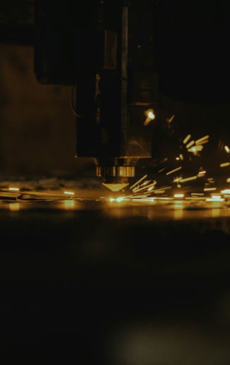 a close up of a machine cutting a piece of metal